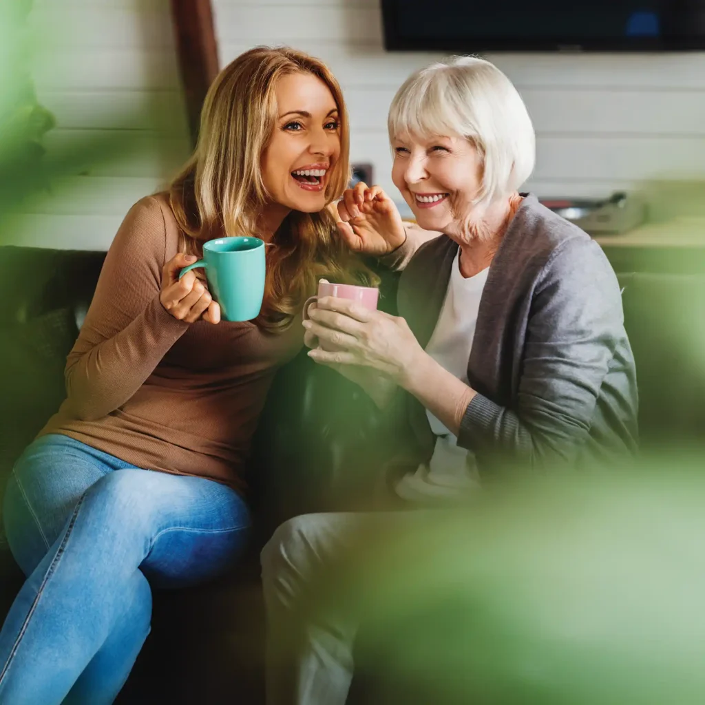 Mother and adult child enjoying a cup of coffee