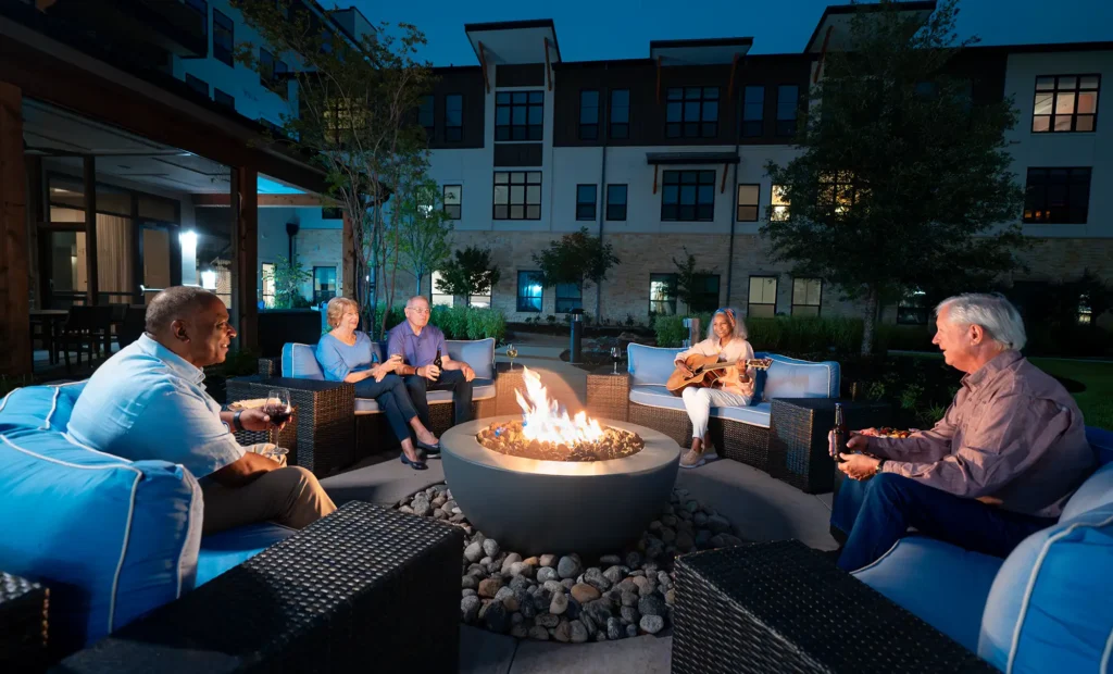 Residents enjoying time around the fire pit at The Outlook