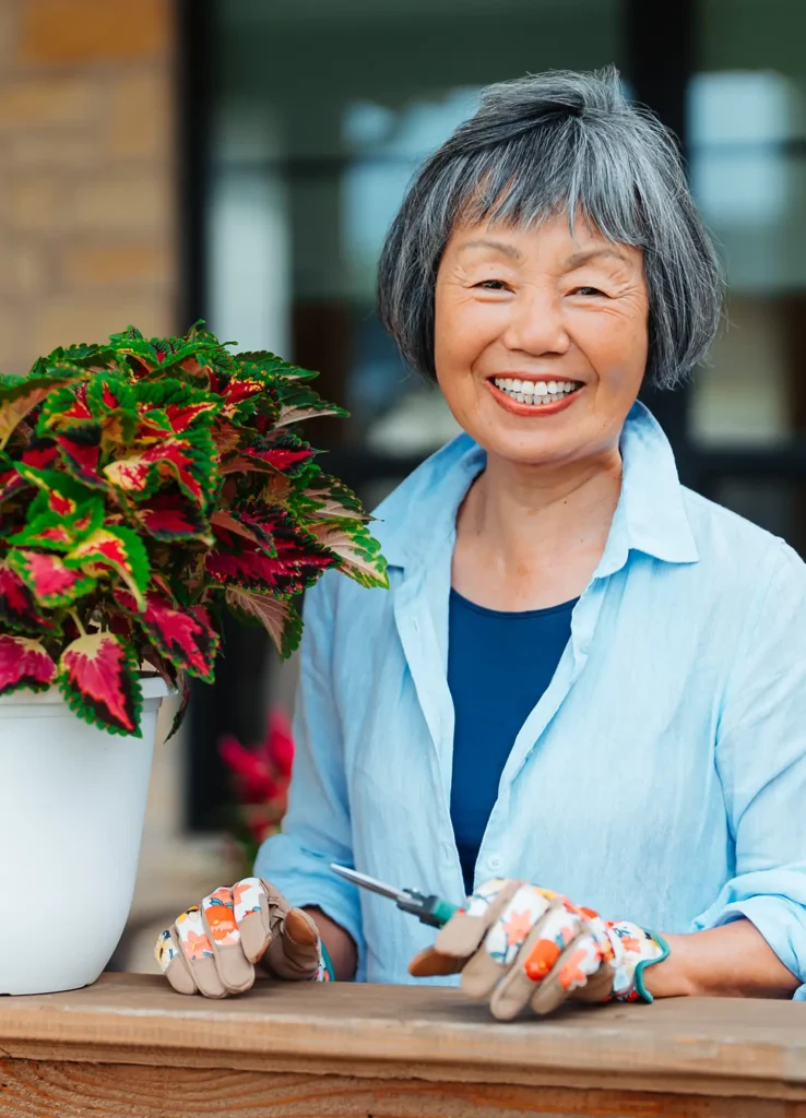 Outlook resident gardening at their cottage home