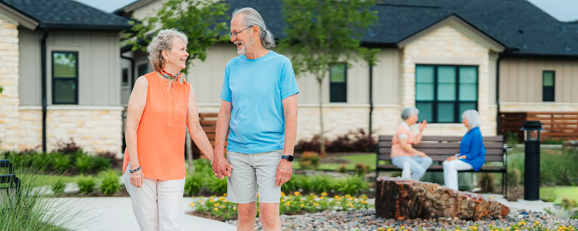 Residents walking through The Grove at The Outlook