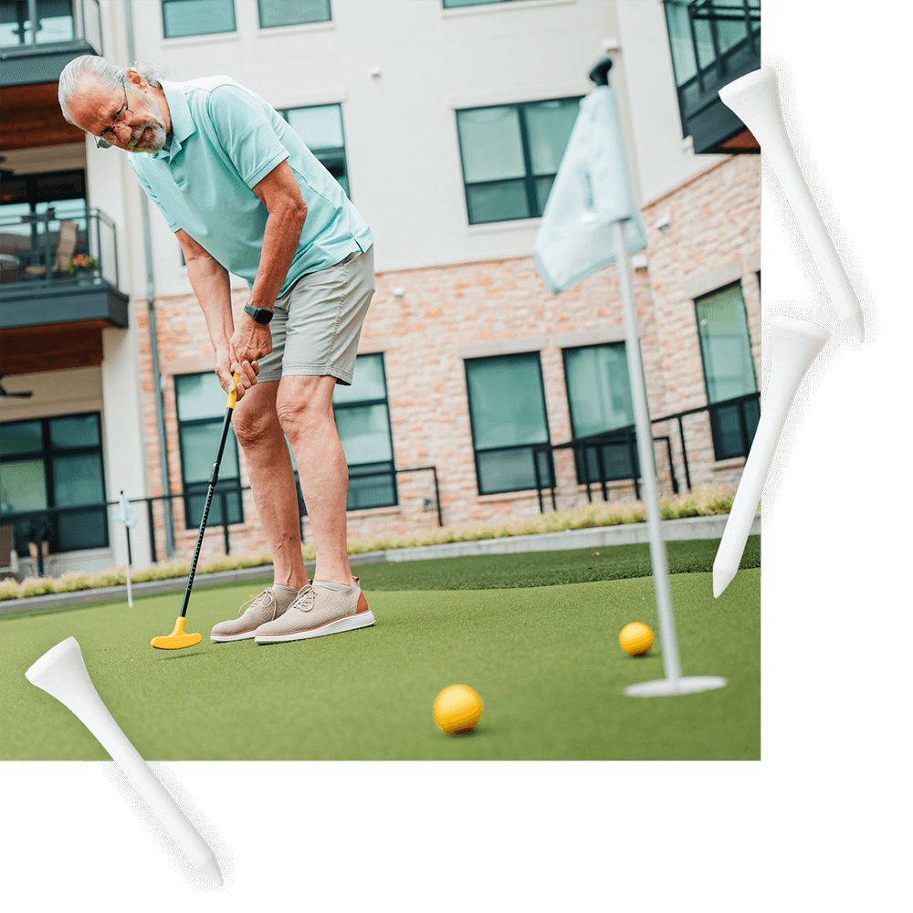 Outlook resident using the putting green