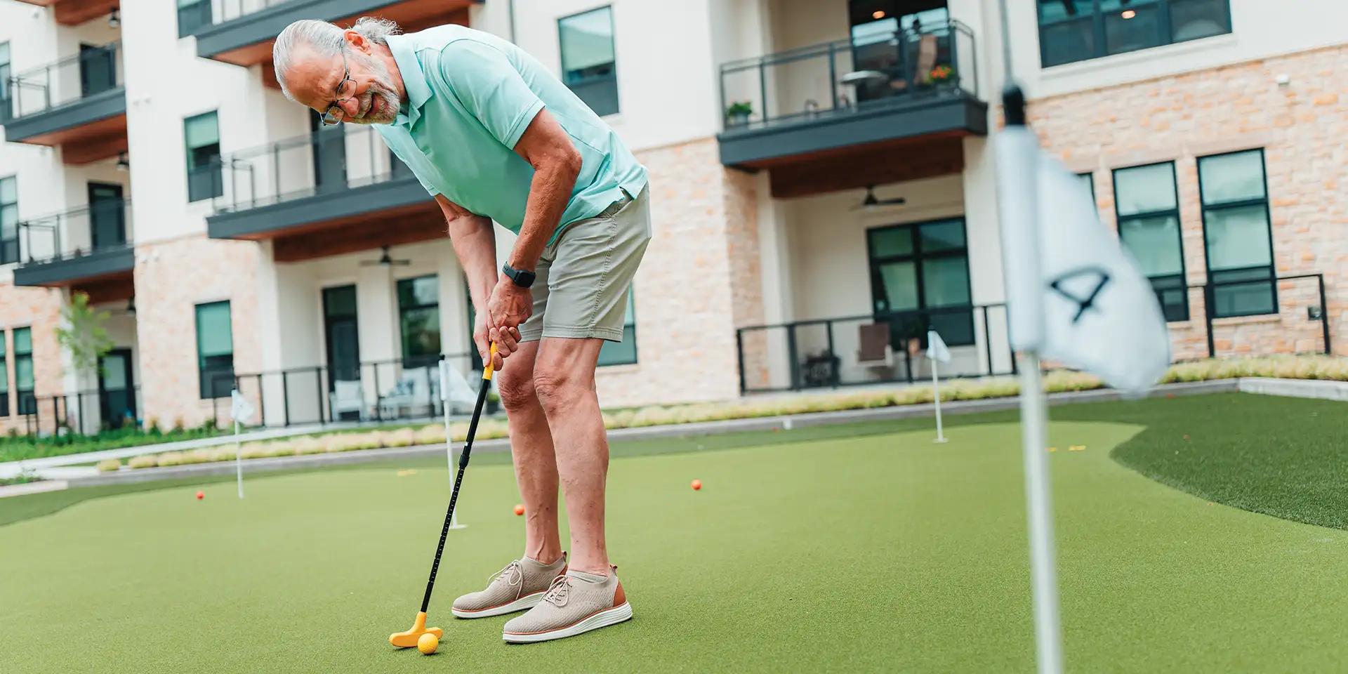 Outlook resident enjoying the putting green